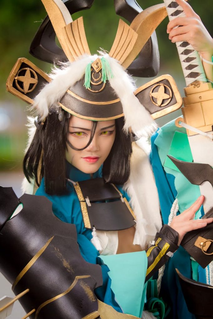 person-wearing-a-costume-2020926 Vibrant cosplay portrait featuring a woman in samurai-themed costume with detailed armor.